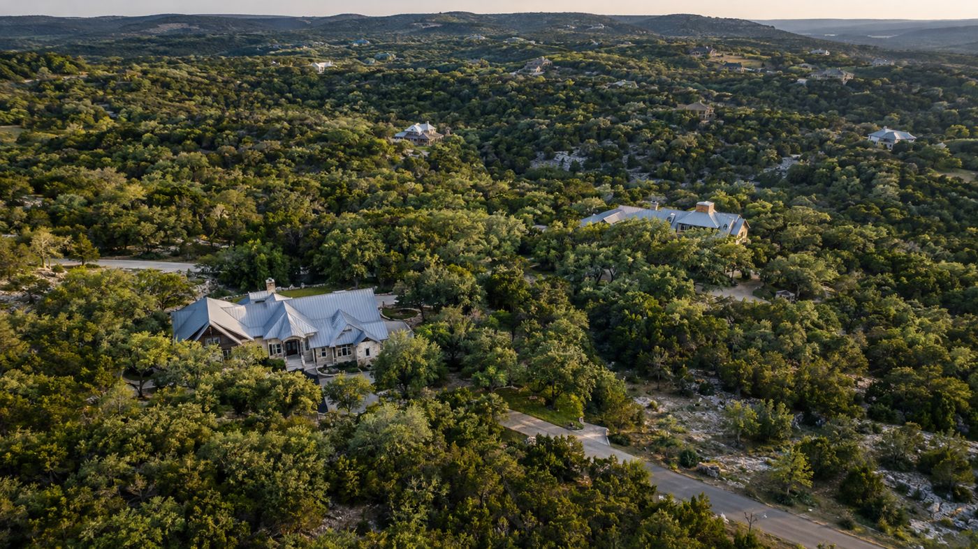 Aerial view of wooded acre lots and custom homes in the Texas Hill Country
